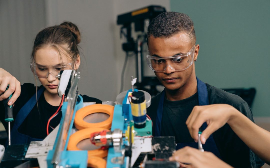 girl and boy fixing electronics